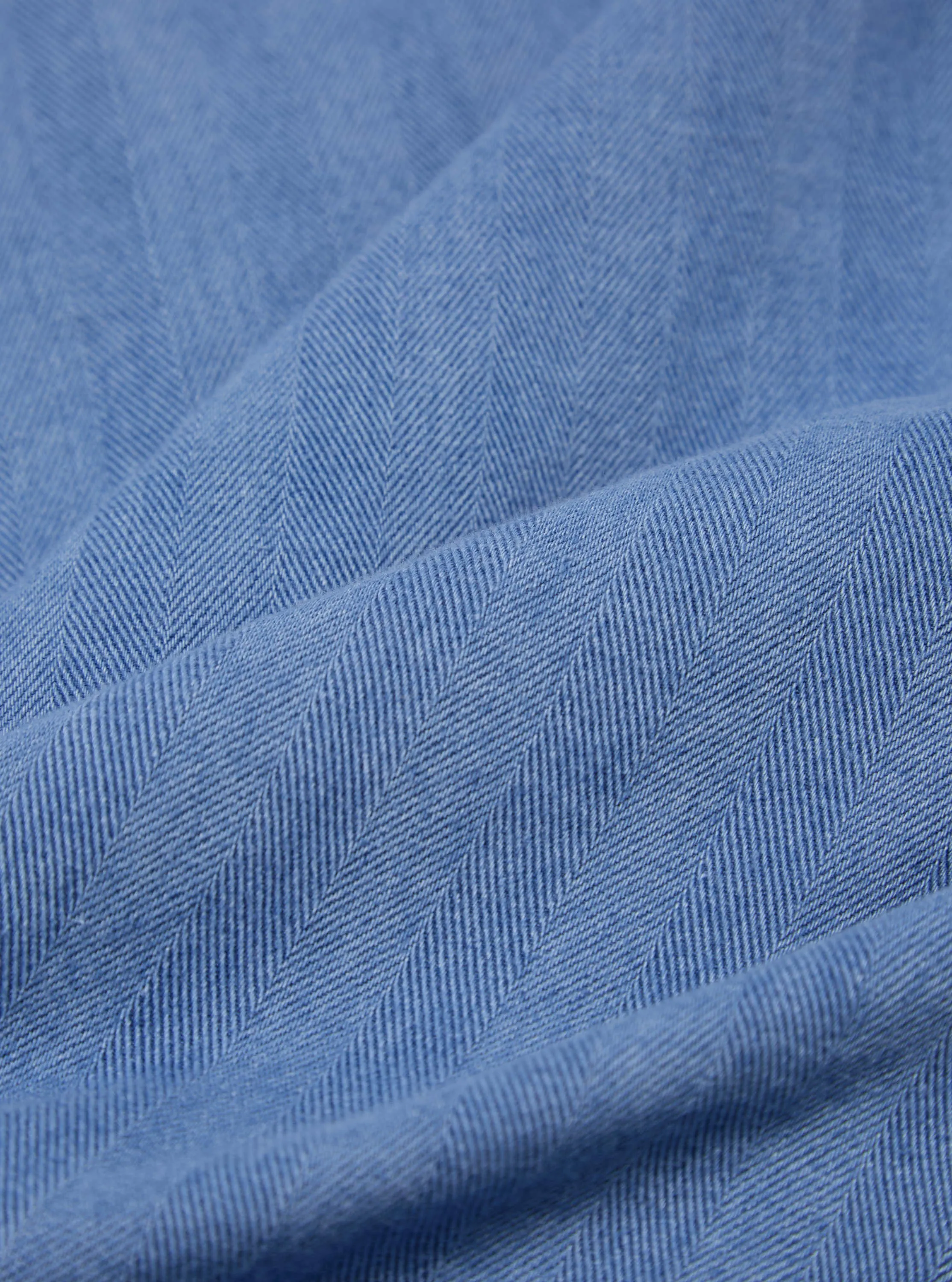 Universal Works Smock Overshirt in Washed Indigo Herringbone Denim